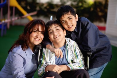 Mom and two sons posing for photo
