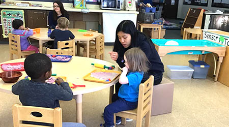 ECS teacher working with children